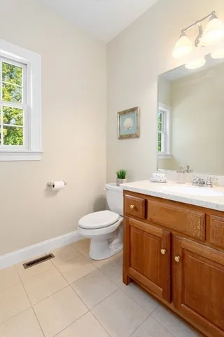 a view of a hallway with wooden floor and stairs