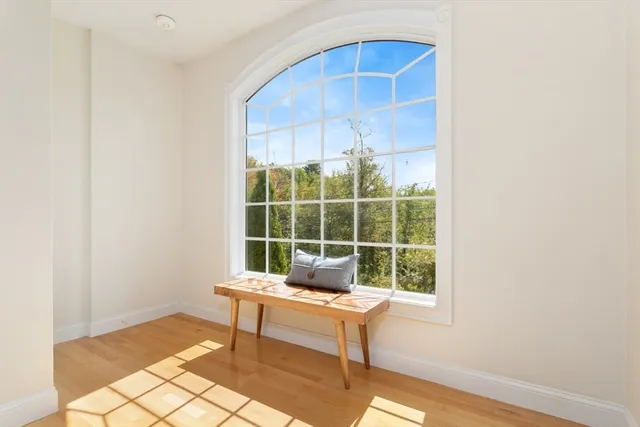 a bedroom with a bed a couch and a window