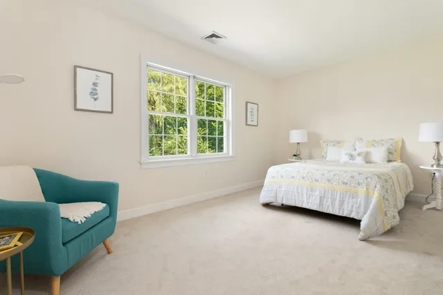 a bathroom with a sink double vanity granite and a toilet