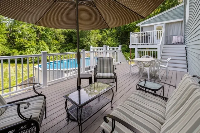 a living room with furniture and floor to ceiling windows