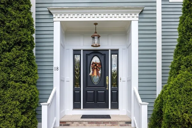 a view of an entryway with wooden floor