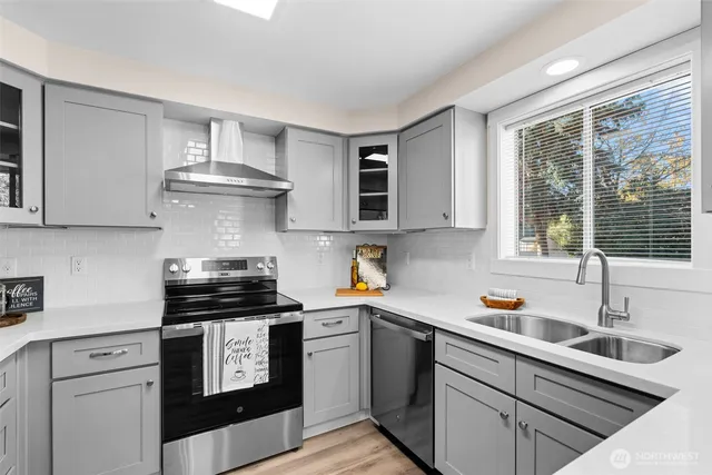 a kitchen with a stove and a sink