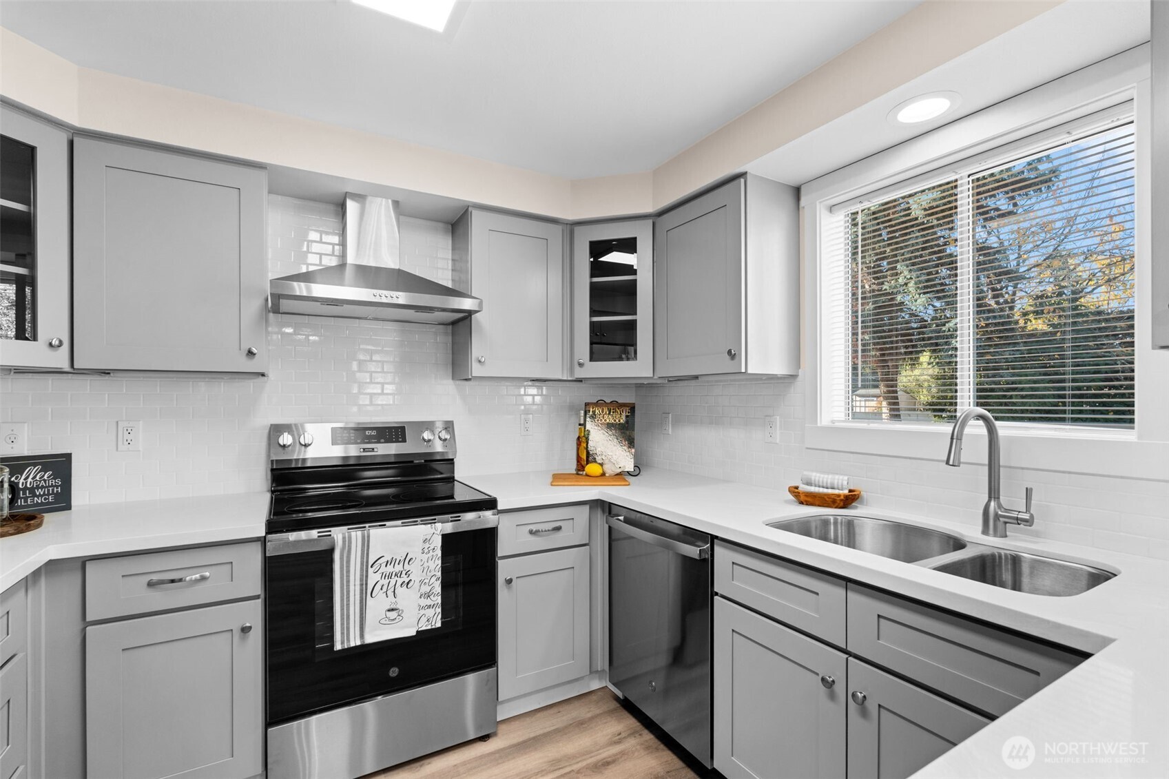 720 7th Street Southwest Puyallup, WA 98371 - Photo 12 of 40 a kitchen with a stove and a sink