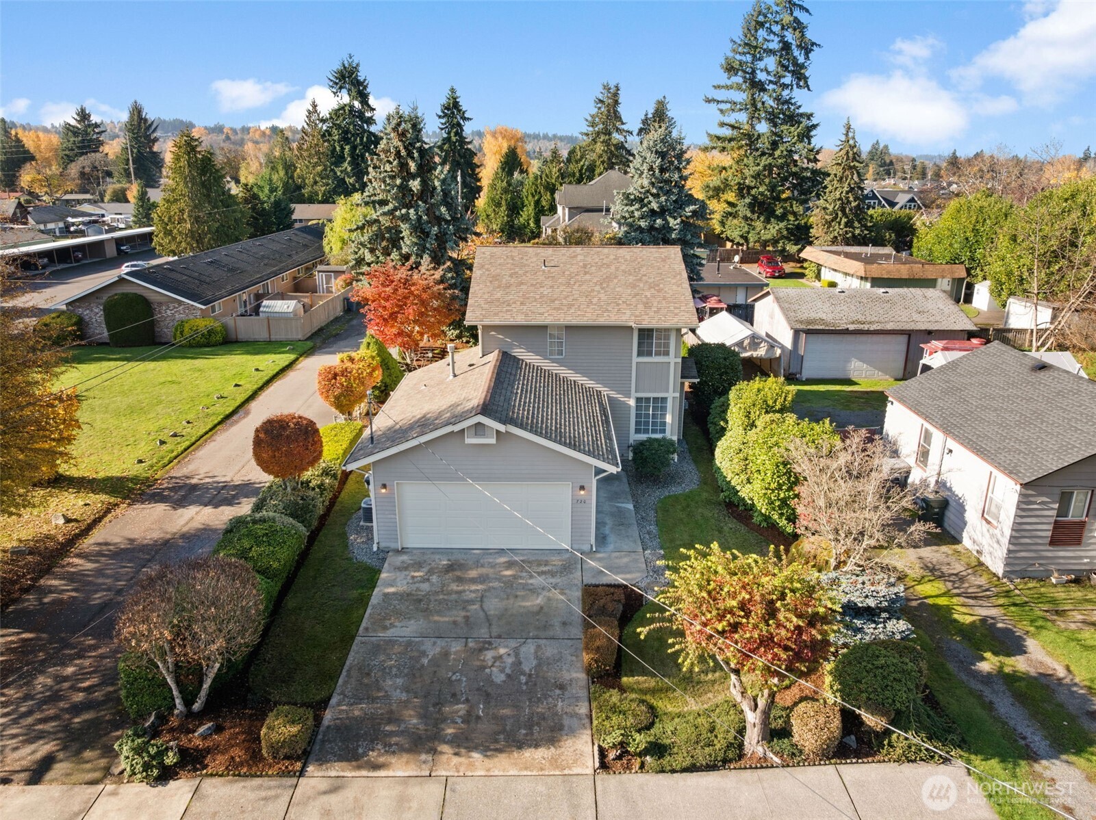 720 7th Street Southwest Puyallup, WA 98371 - Photo 2 of 40 an aerial view of a house with a garden and lake view