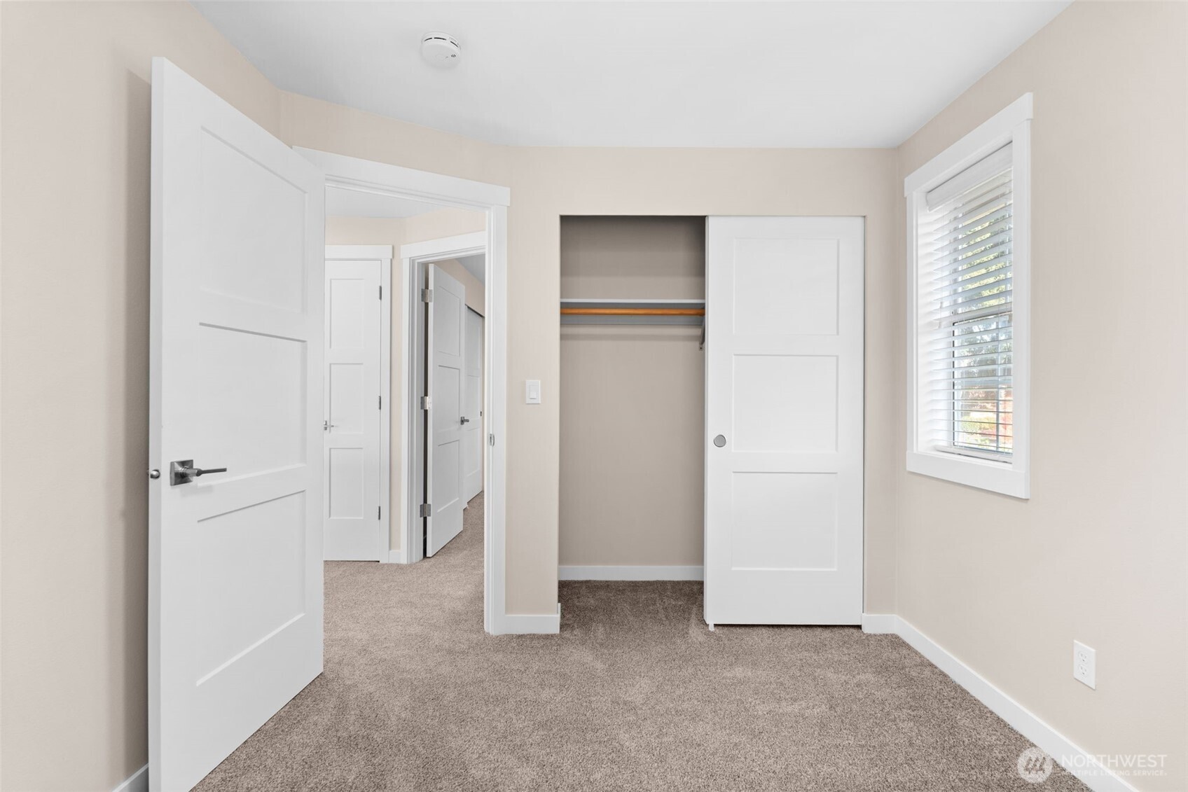 720 7th Street Southwest Puyallup, WA 98371 - Photo 27 of 40 a view of an empty room with closet and a window
