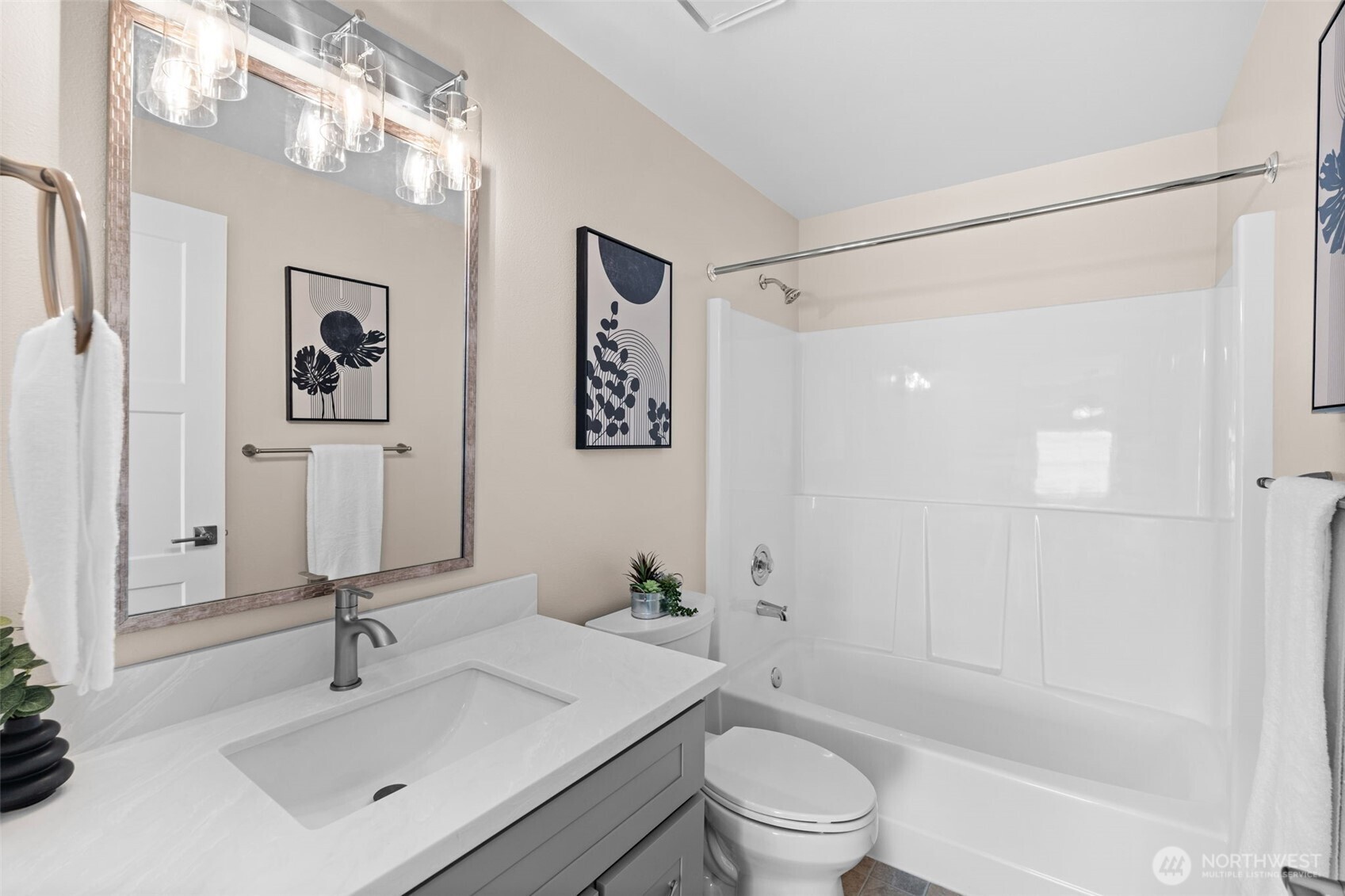 720 7th Street Southwest Puyallup, WA 98371 - Photo 30 of 40 a bathroom with a sink a toilet and shower