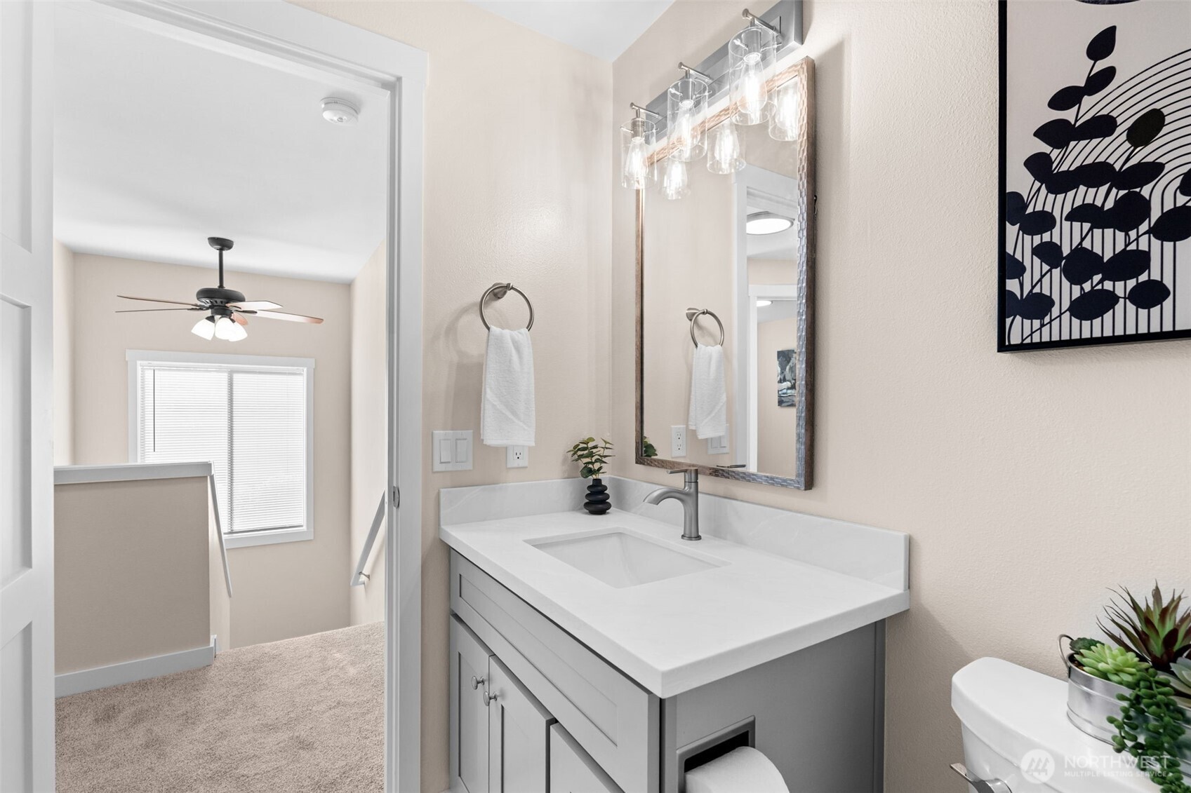 720 7th Street Southwest Puyallup, WA 98371 - Photo 31 of 40 a bathroom with a sink a toilet and shower