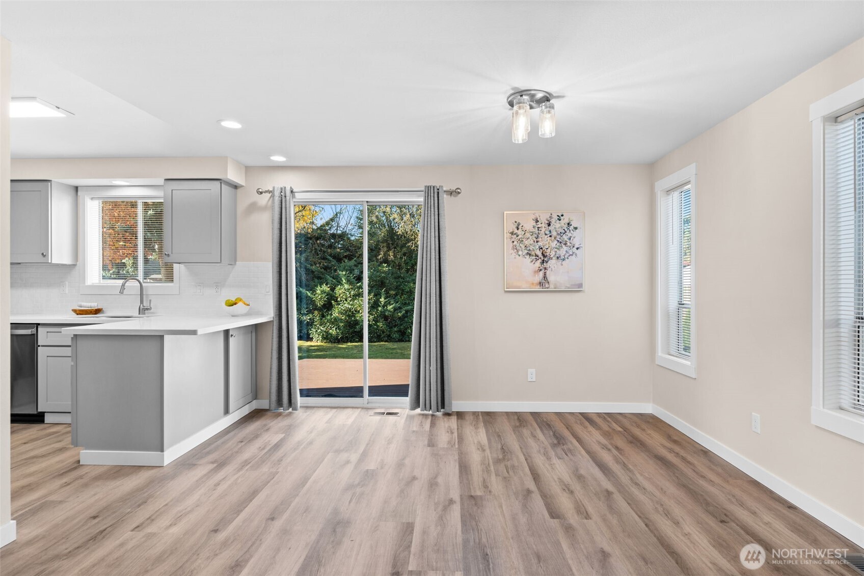 720 7th Street Southwest Puyallup, WA 98371 - Photo 9 of 40 a view of a hallway with wooden floor and a window
