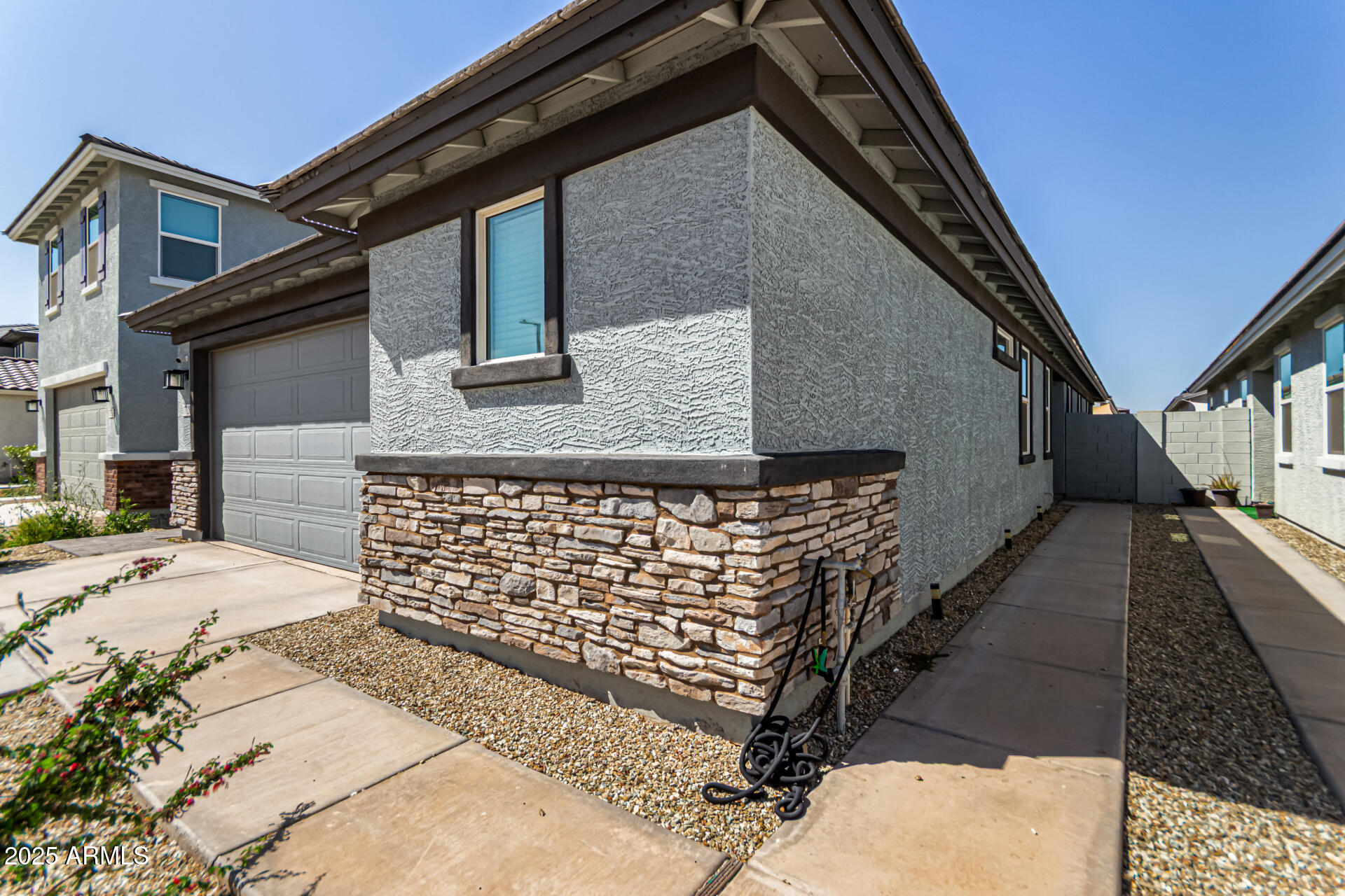 17320 West Daley Lane Surprise, AZ 85387 - Photo 12 of 46 a front view of a house with stairs