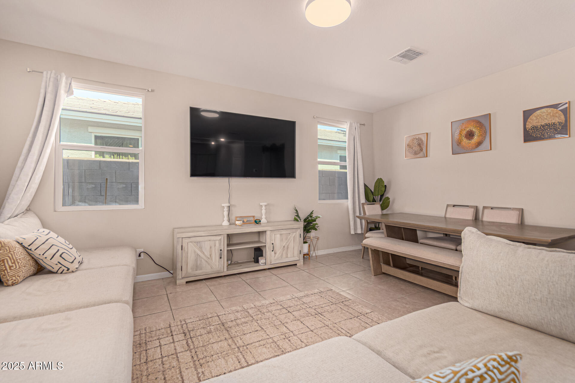 17320 West Daley Lane Surprise, AZ 85387 - Photo 14 of 46 a living room with furniture and a flat screen tv