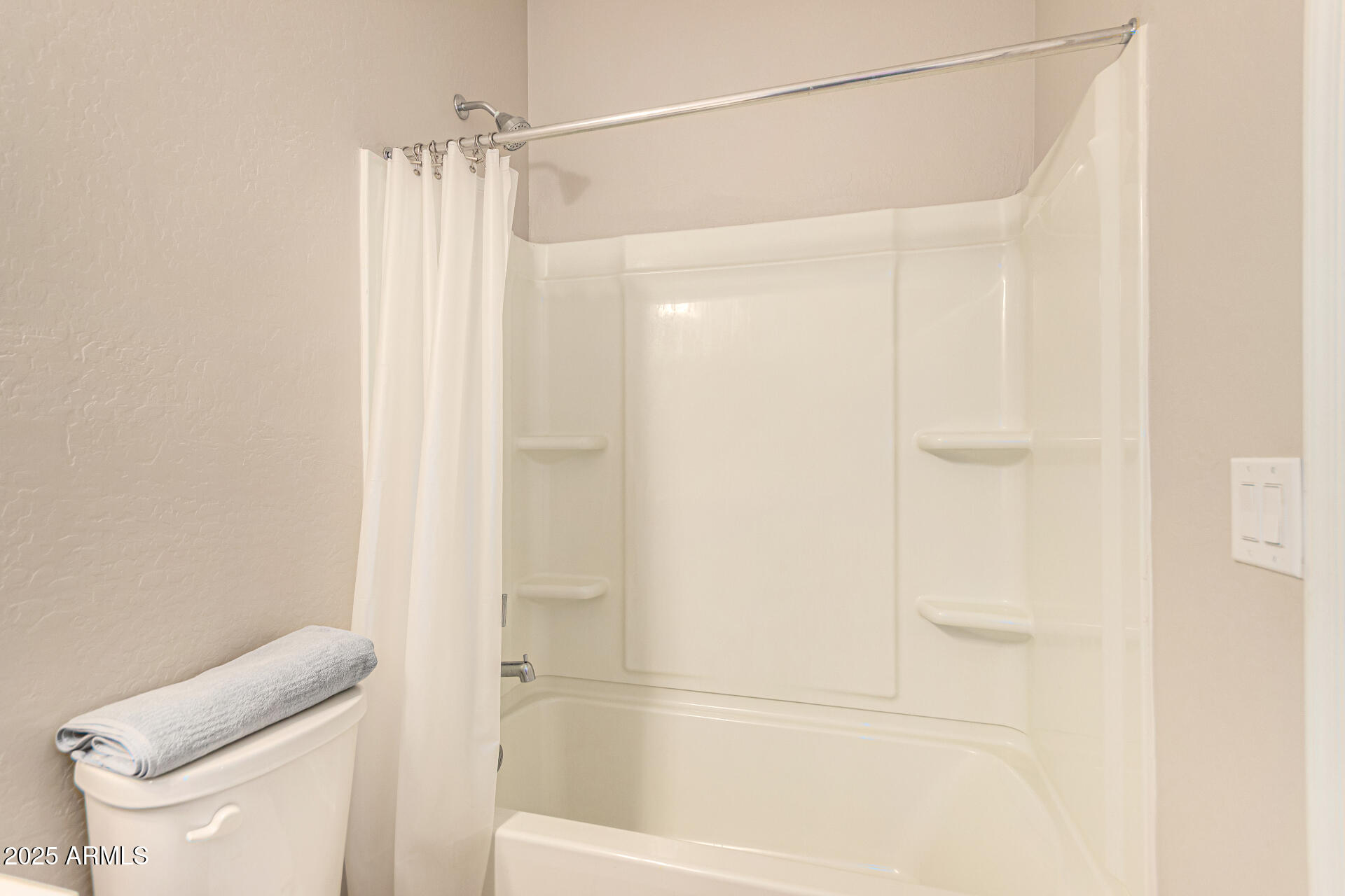 17320 West Daley Lane Surprise, AZ 85387 - Photo 26 of 46 a bathroom with a shower and a toilet