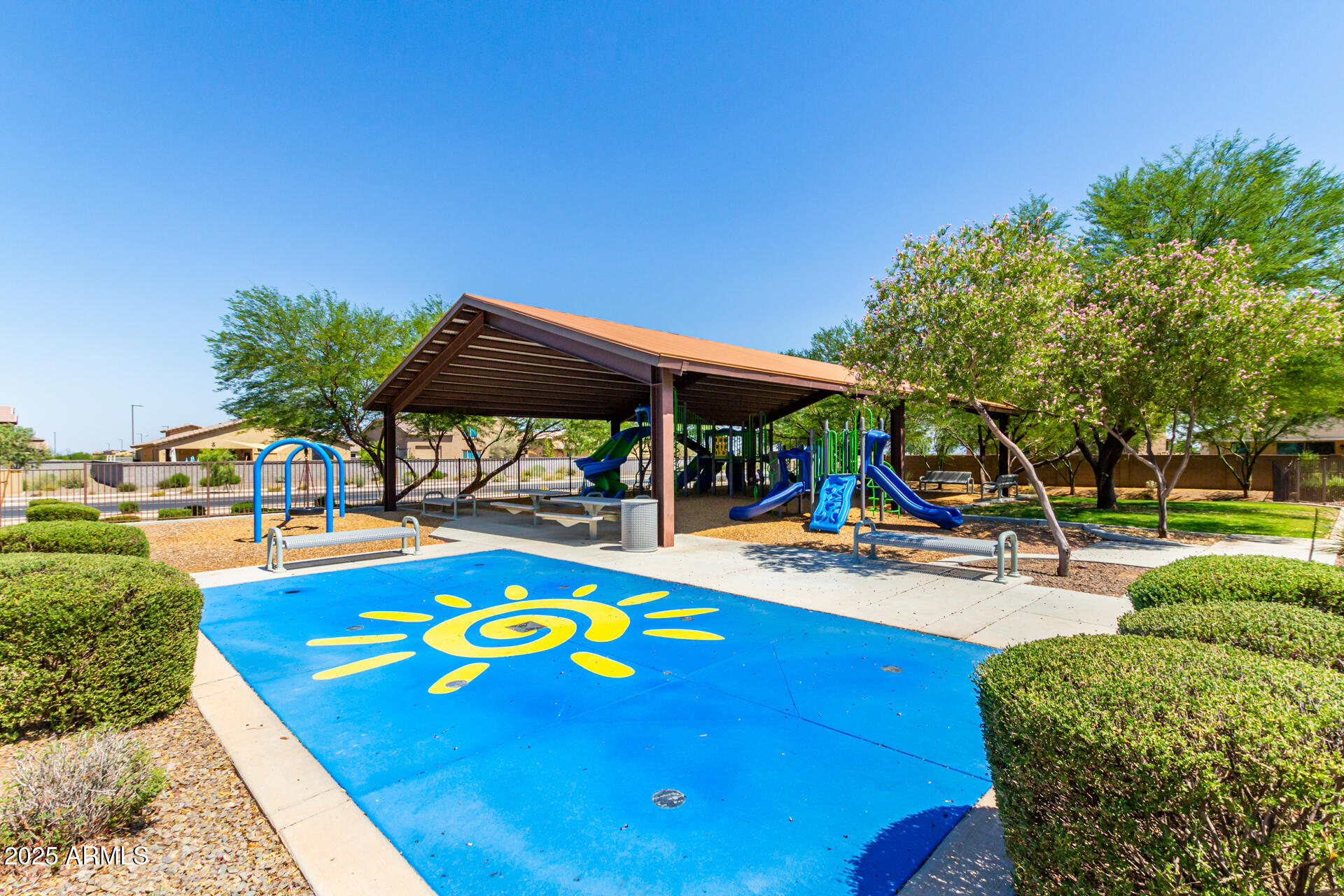 17320 West Daley Lane Surprise, AZ 85387 - Photo 43 of 46 a view of a swimming pool with chairs and tables