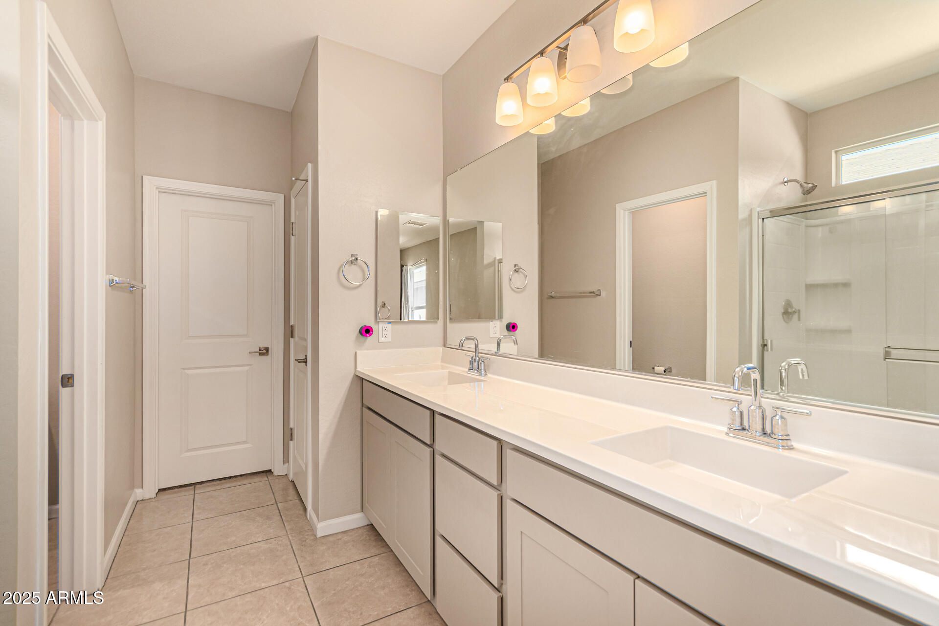17320 West Daley Lane Surprise, AZ 85387 - Photo 7 of 46 a bathroom with a sink double vanity and a mirror