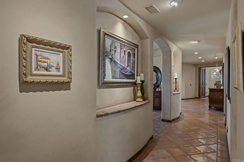 3244 Olivenhain Farms Road Encinitas, CA 92024 - Photo 22 of 47 a view of a hallway with wooden shelves