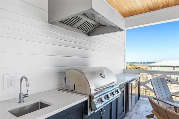 a bedroom with a bed wooden floor and window