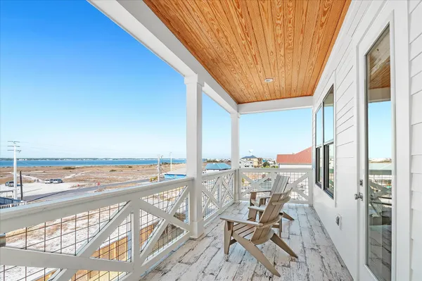 a bedroom with a bed and flat screen tv