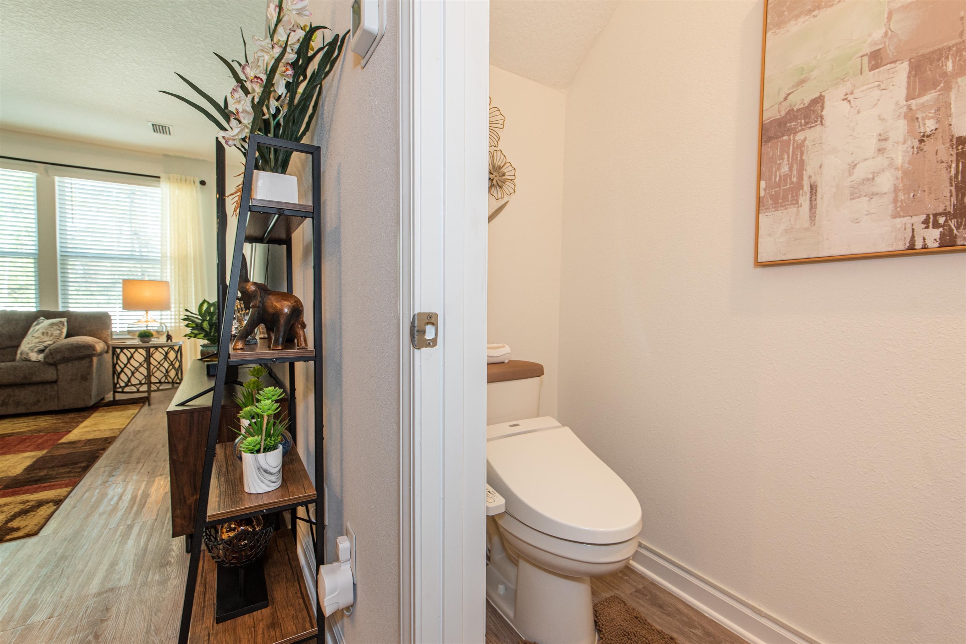 18 Ridge Lake Road St. Augustine, FL 32086 - Photo 23 of 47 a bathroom with a toilet a sink and a mirror