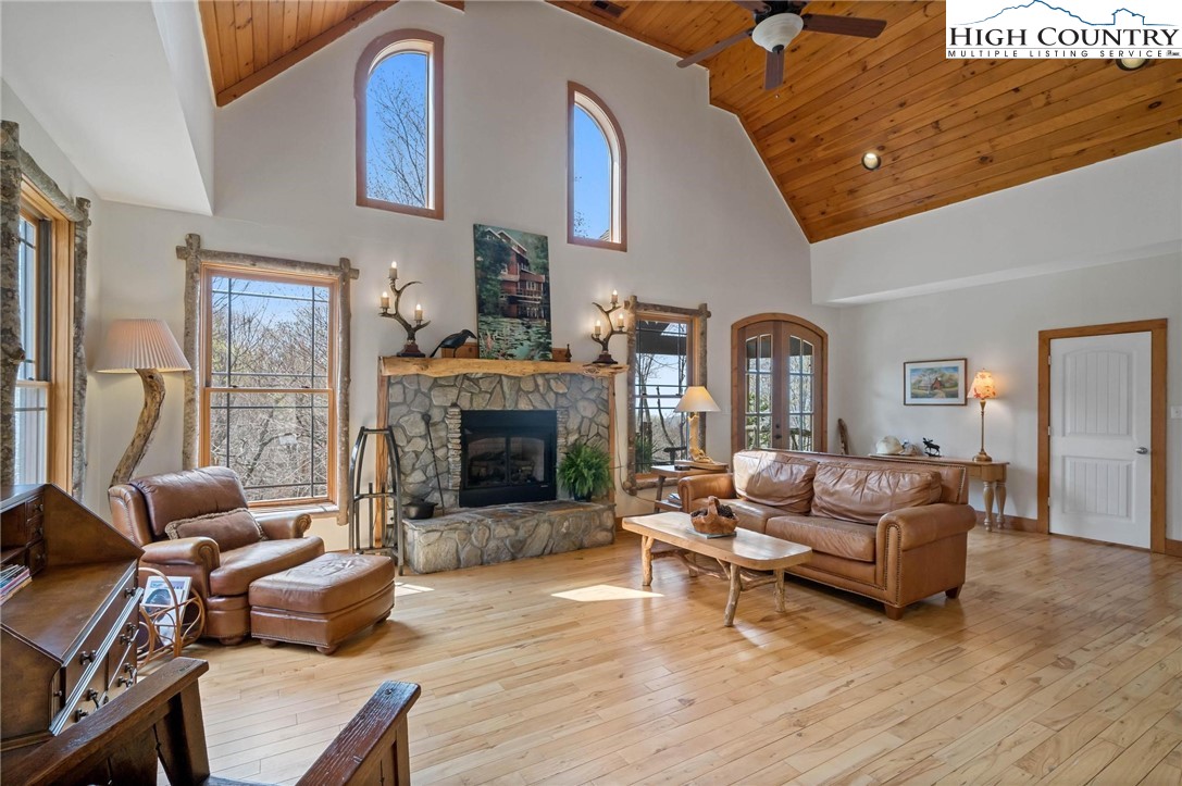 140 Spruce Hollow Road Beech Mountain, NC 28604 - Photo 10 of 50 a living room with furniture and a fireplace