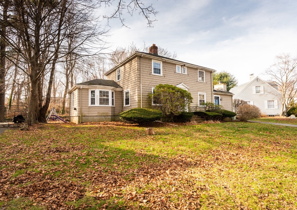 10 Mohawk Road Marblehead, MA 01945 - Photo 2 of 28 a front view of a house with a garden