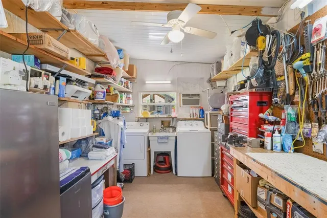 a utility room with stainless steel appliances and cabinets