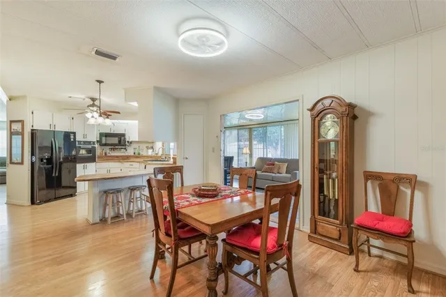 a dining room with furniture and window