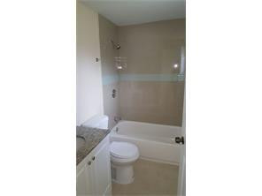 2180 Northwest 3rd Street Pompano Beach, FL 33069 - Photo 3 of 6 a bathroom with a sink a toilet and shower