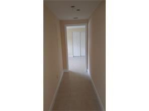 2180 Northwest 3rd Street Pompano Beach, FL 33069 - Photo 6 of 6 a view of a hallway with a white walls