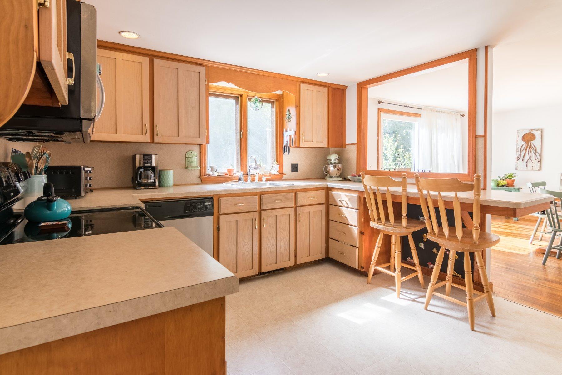 247 Chatham Road Harwich, MA 02645 - Photo 13 of 33 a view of a kitchen with kitchen island granite countertop lots of counter top space and stainless steel appliances