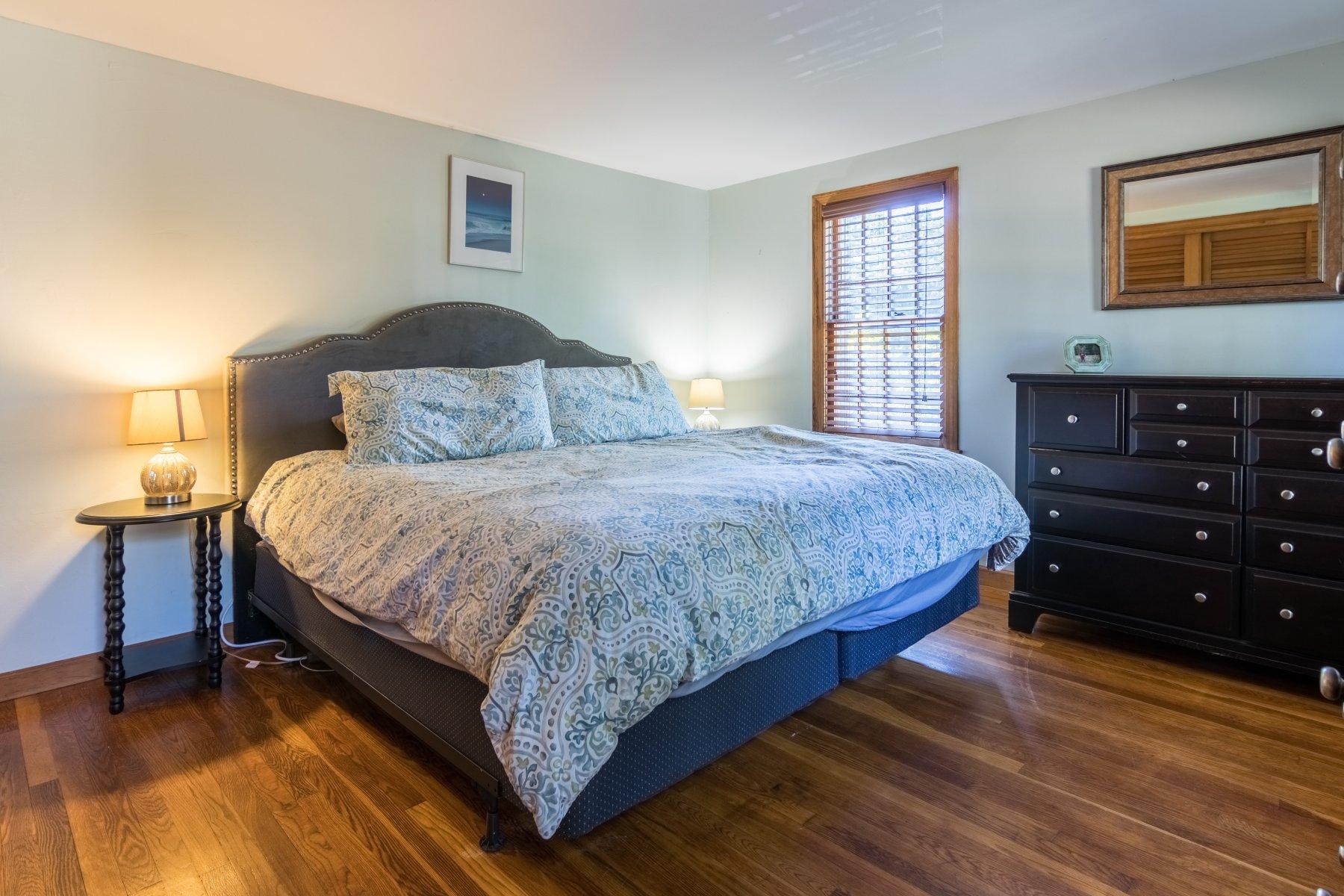 247 Chatham Road Harwich, MA 02645 - Photo 16 of 33 a bedroom with a bed and a dresser
