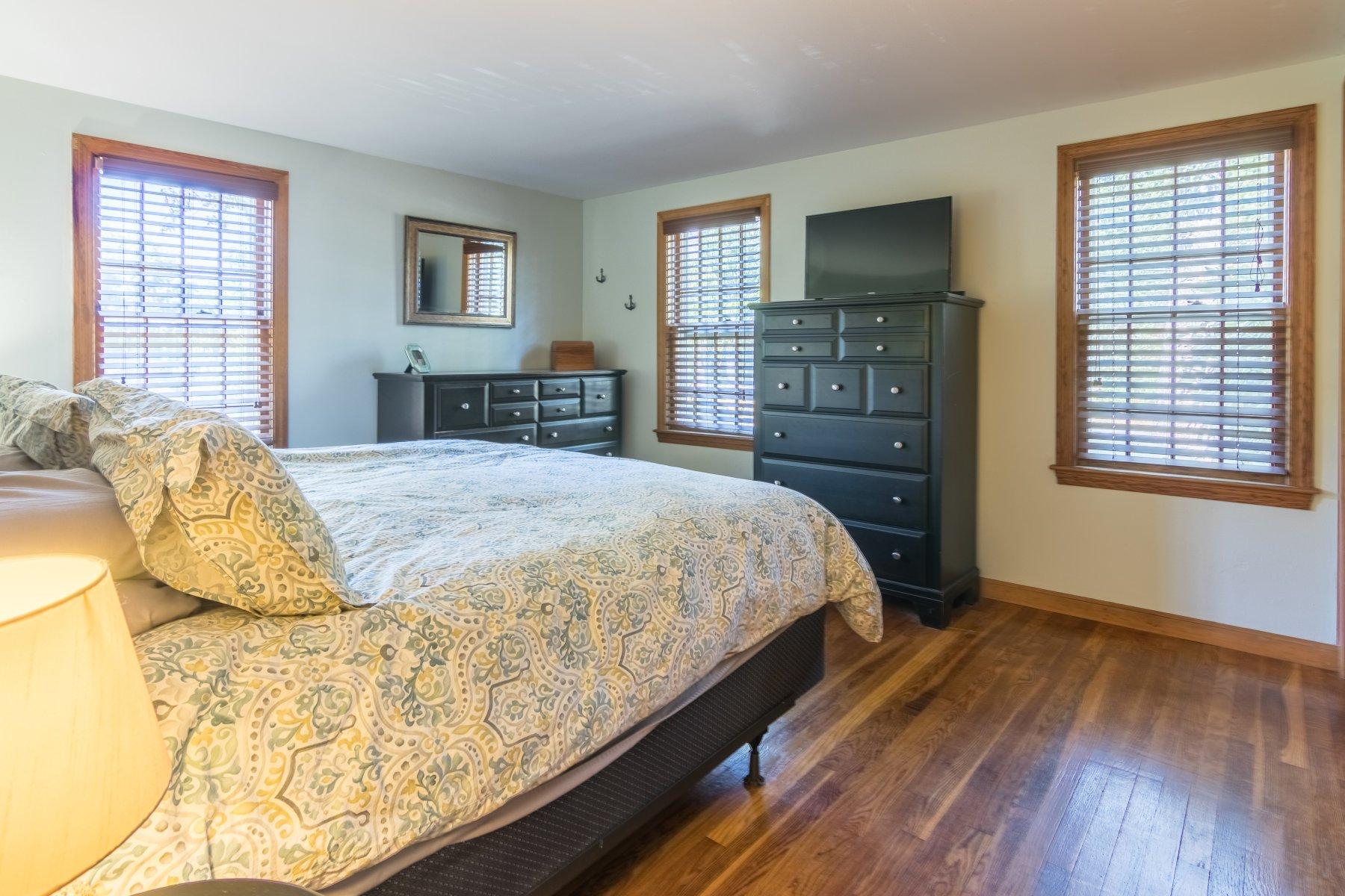 247 Chatham Road Harwich, MA 02645 - Photo 17 of 33 a spacious bedroom with a bed and a dresser in it