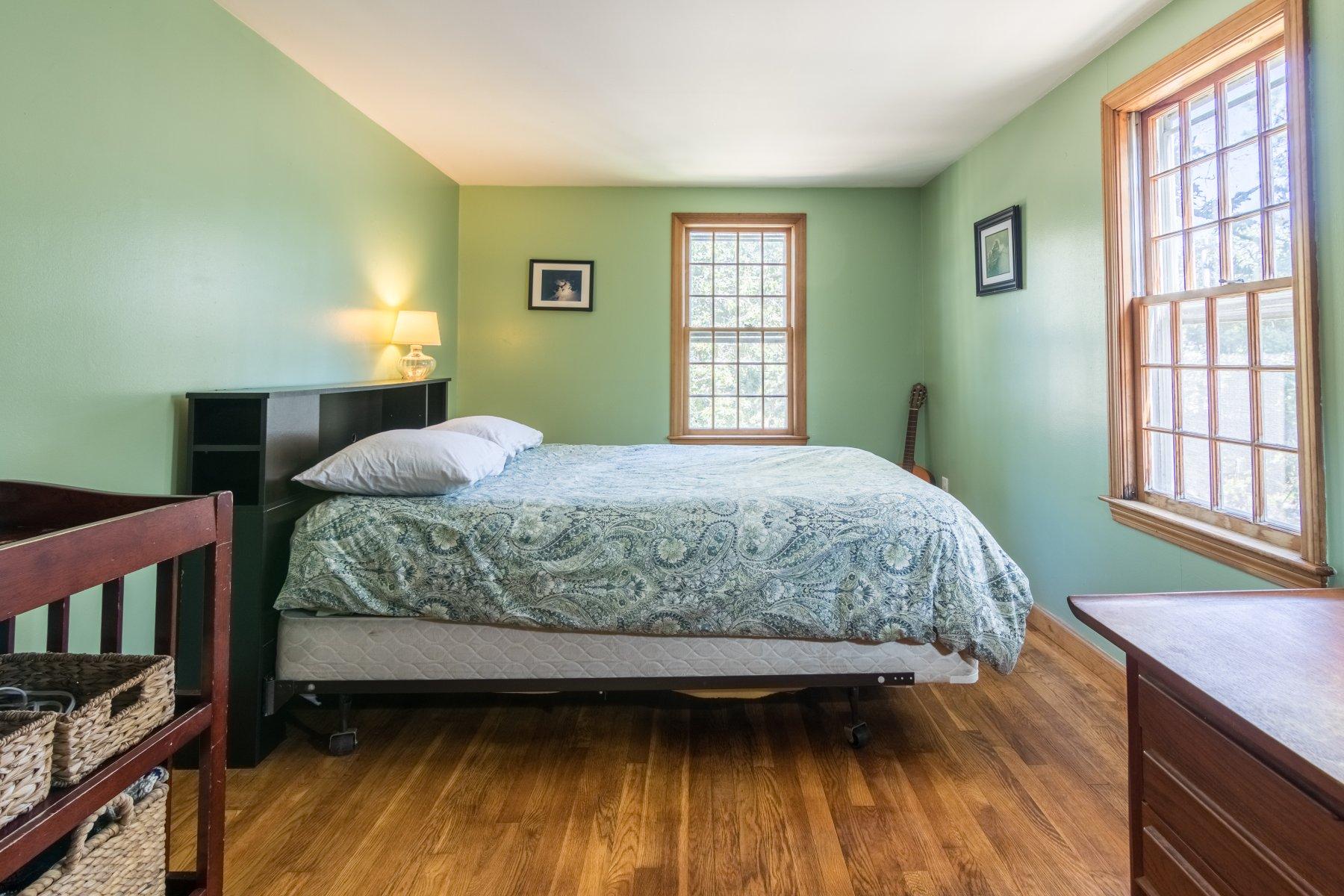 247 Chatham Road Harwich, MA 02645 - Photo 22 of 33 a bedroom with a bed wooden floor and window