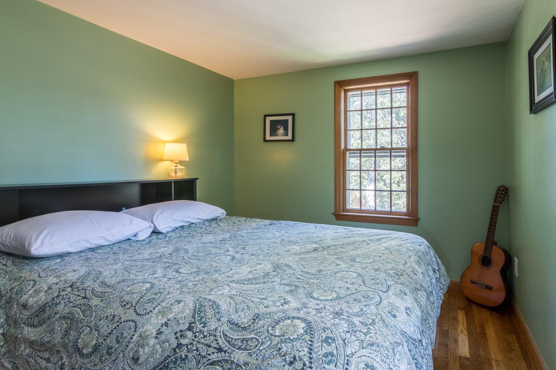 247 Chatham Road Harwich, MA 02645 - Photo 23 of 33 a bedroom with a bed and a window