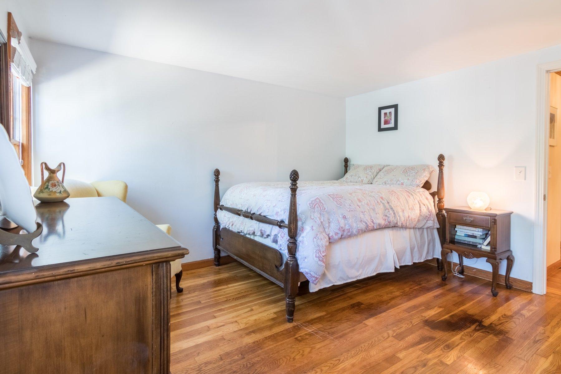 247 Chatham Road Harwich, MA 02645 - Photo 25 of 33 a bedroom with a bed and a table in it