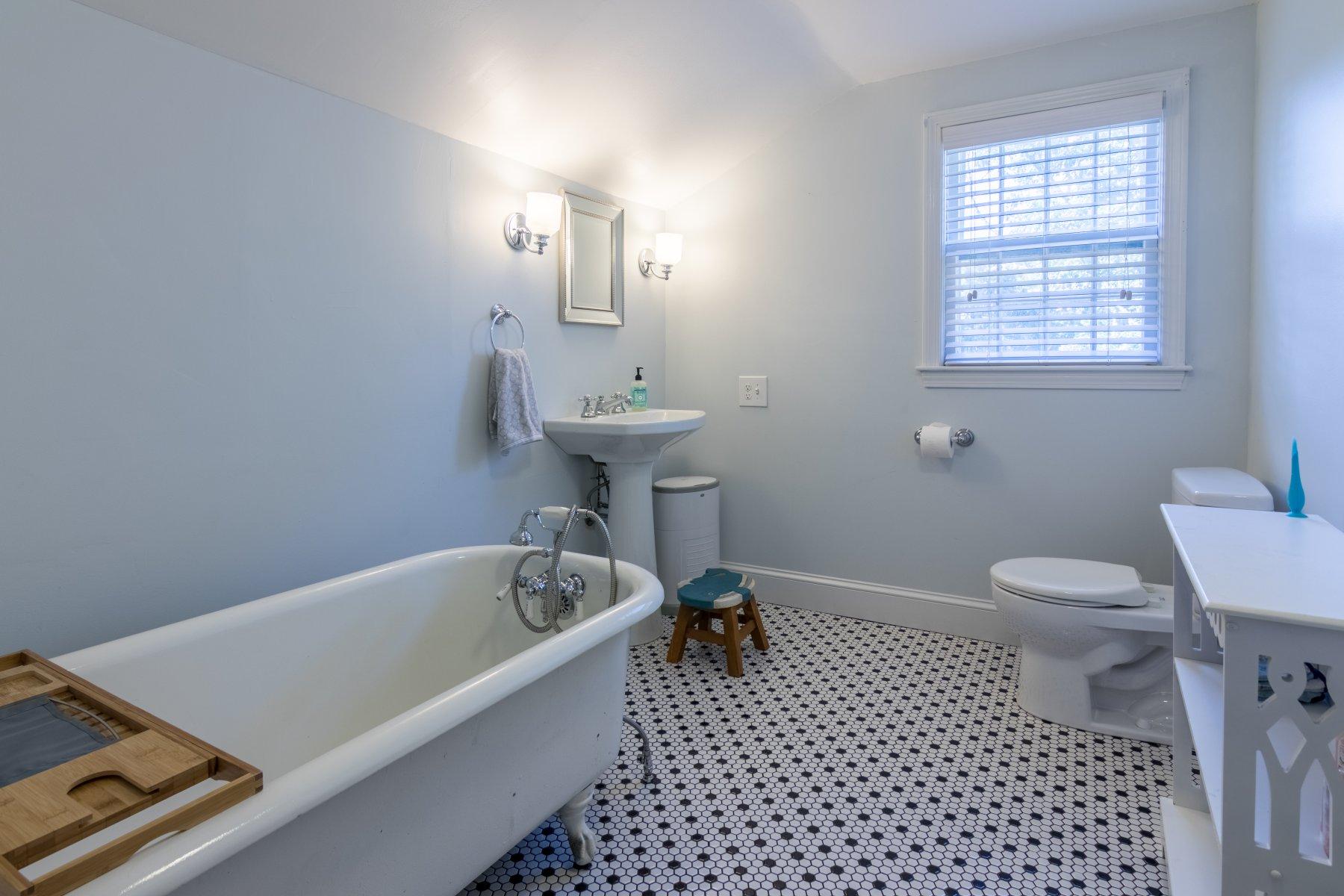 247 Chatham Road Harwich, MA 02645 - Photo 26 of 33 a bathroom with a bathtub sink vanity and toilet