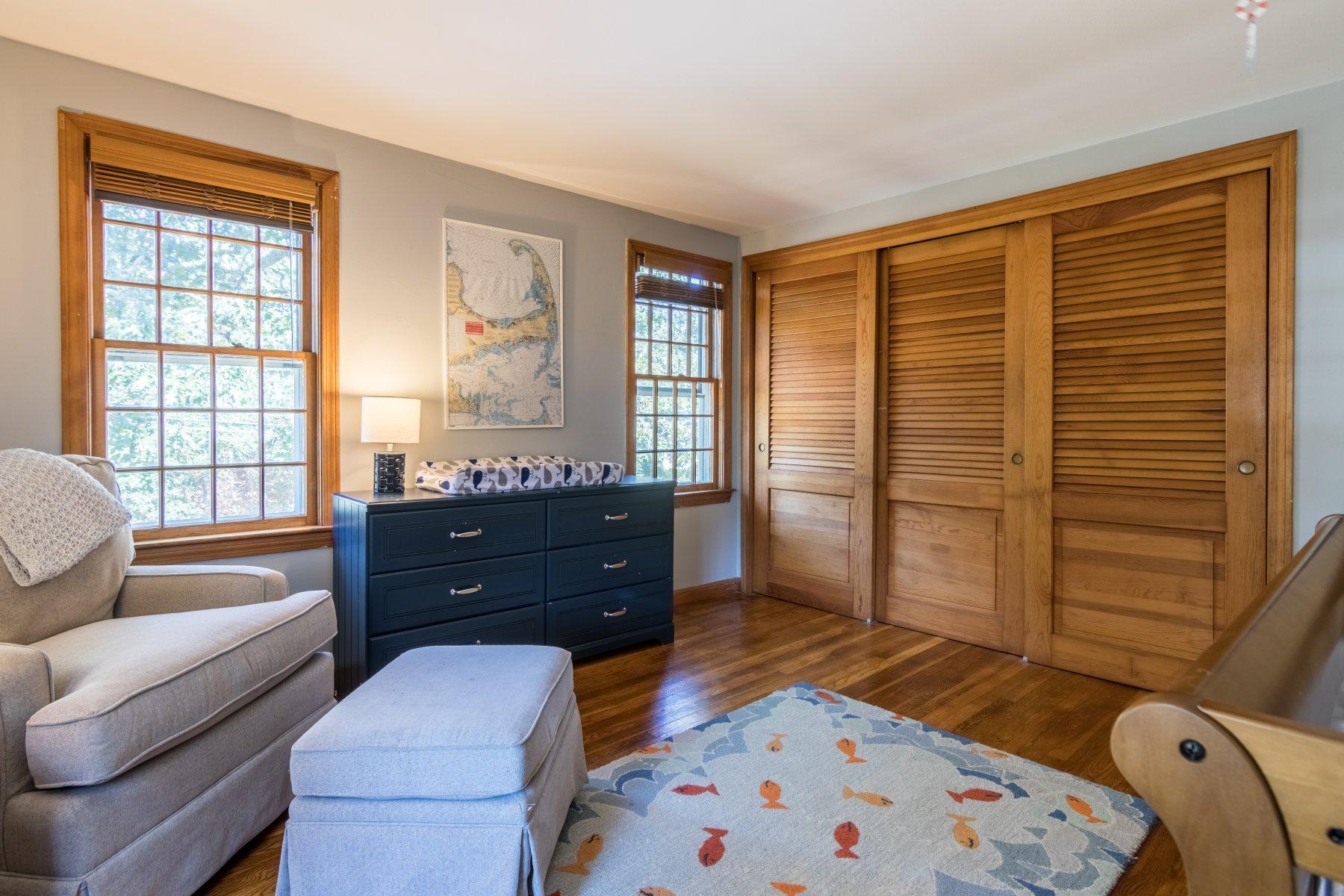 247 Chatham Road Harwich, MA 02645 - Photo 29 of 33 a bedroom with a bed and wooden floor