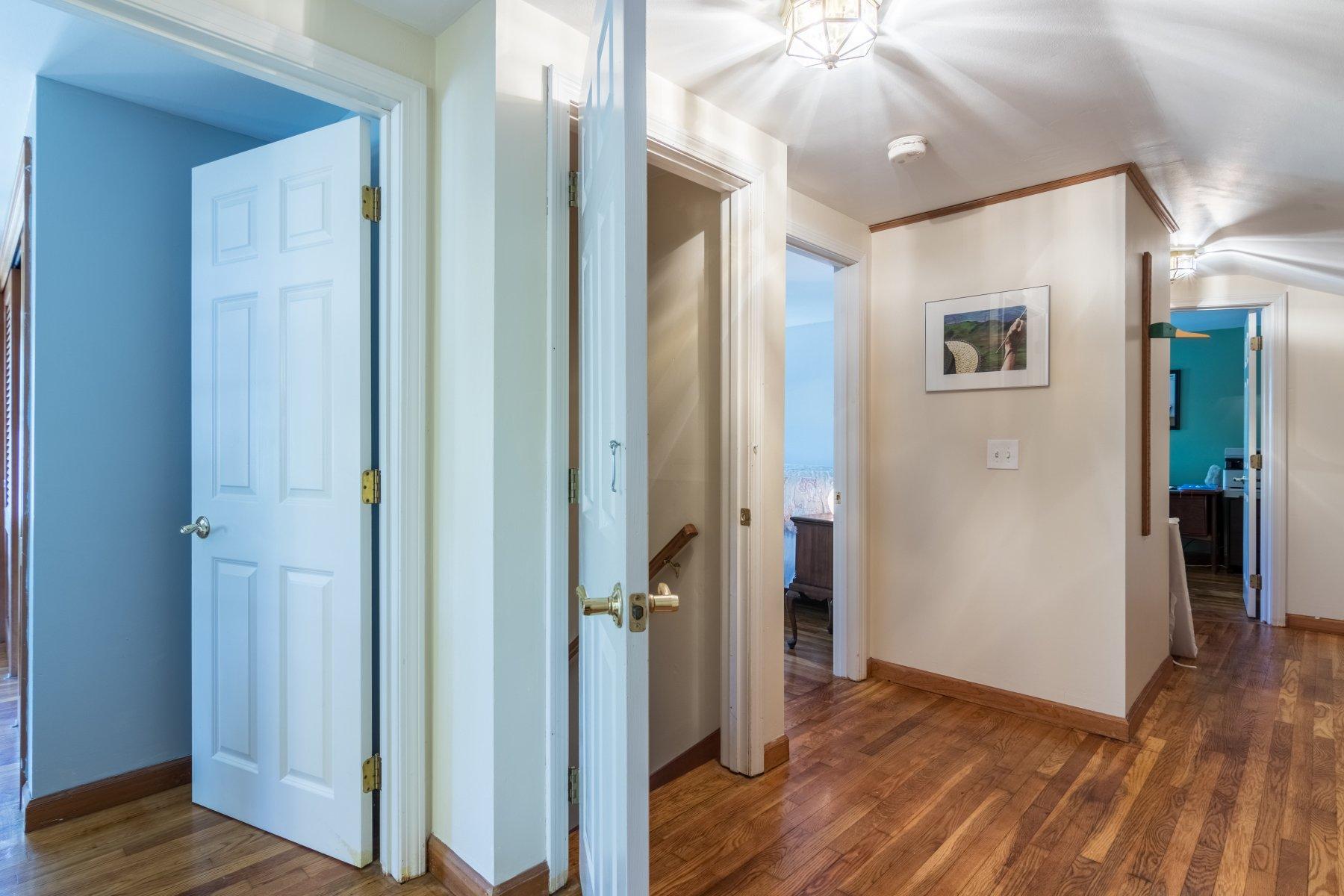 247 Chatham Road Harwich, MA 02645 - Photo 30 of 33 a view of a hallway with wooden floor and staircase