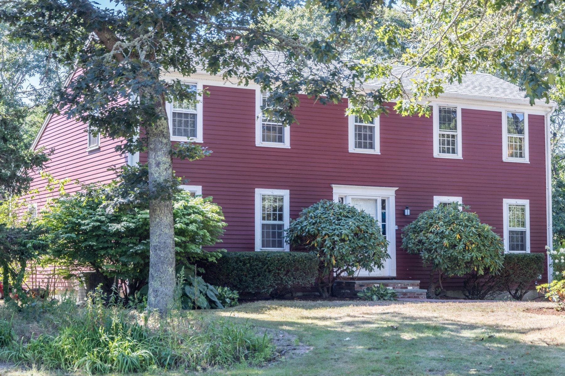 247 Chatham Road Harwich, MA 02645 - Photo 33 of 33 a view of a brick house with a yard and plants