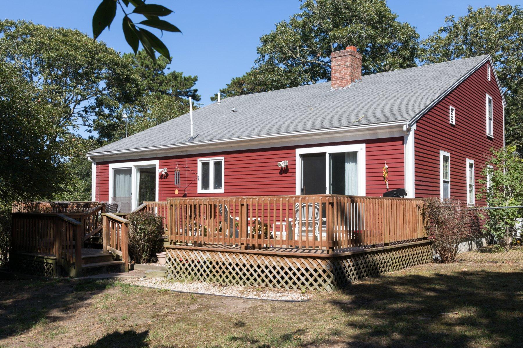 247 Chatham Road Harwich, MA 02645 - Photo 4 of 33 a front view of a house with a garden