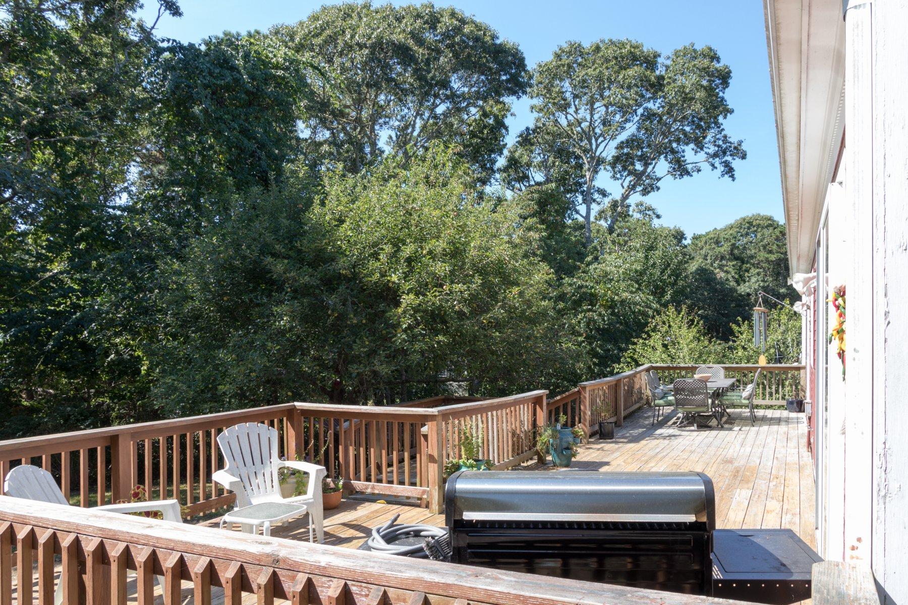 247 Chatham Road Harwich, MA 02645 - Photo 5 of 33 a view of balcony with wooden floor and outdoor seating