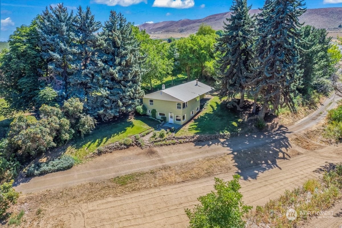 1350 Tozer Road Ellensburg, WA 98926 - Photo 1 of 40 a view of a street with a trees
