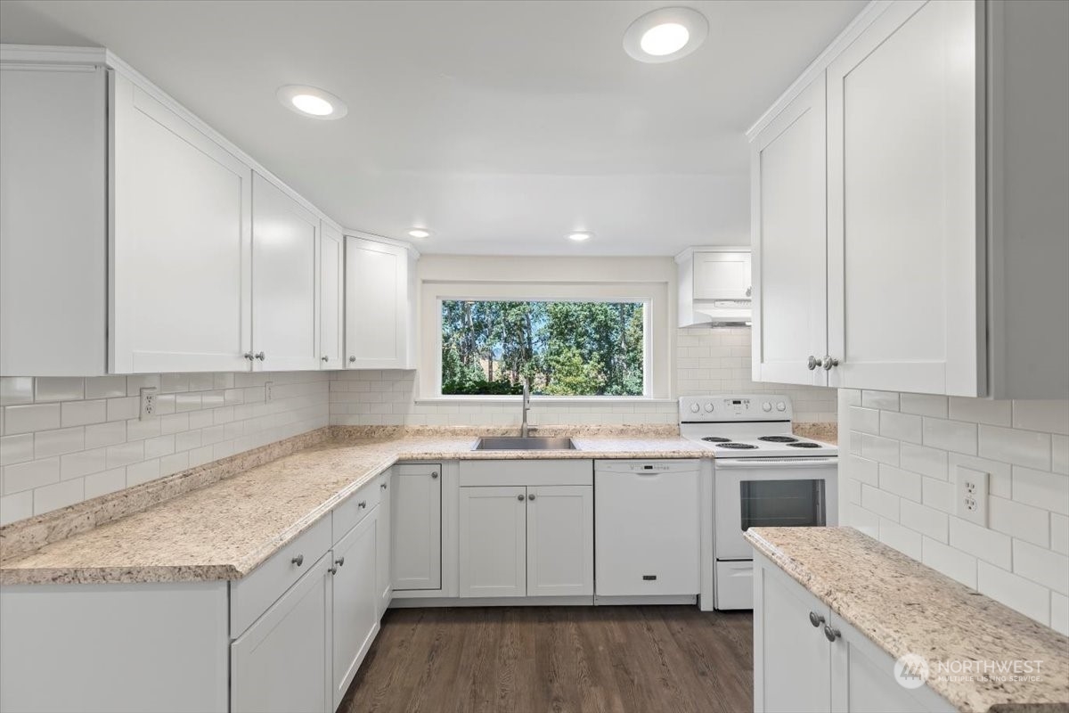 1350 Tozer Road Ellensburg, WA 98926 - Photo 7 of 40 a kitchen with a sink stove and cabinets