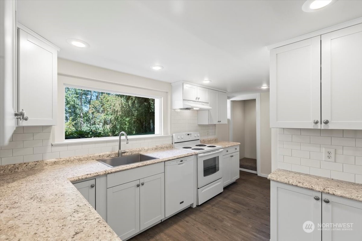 1350 Tozer Road Ellensburg, WA 98926 - Photo 8 of 40 a kitchen with a sink stove and cabinets