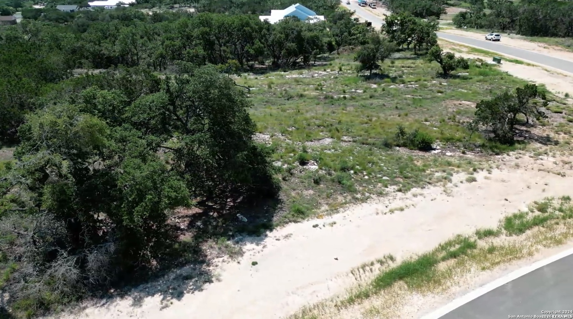 521 Rosemary Rdg Drive Bulverde, TX 78163 - Photo 3 of 4 a view of a yard with plants and a bench