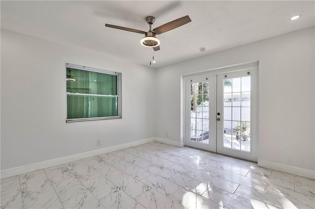 1389 West 33rd Street Riviera Beach, FL 33404 - Photo 7 of 20 a view of an empty room with a window