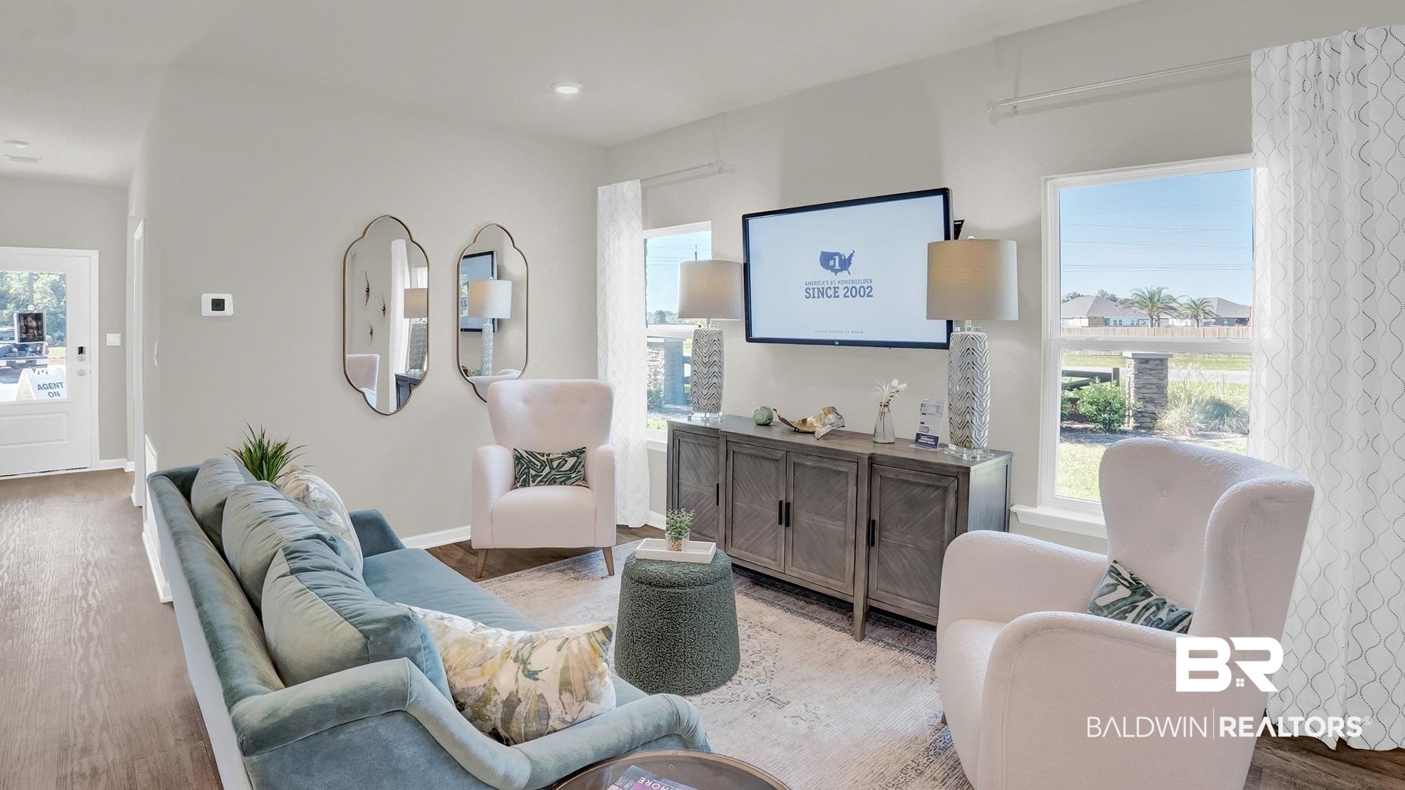 13330 Shea Circle Foley, AL 36535 - Photo 3 of 15 Open-concept living space featuring wood-finish flooring, light grey walls, white trim, and multiple windows