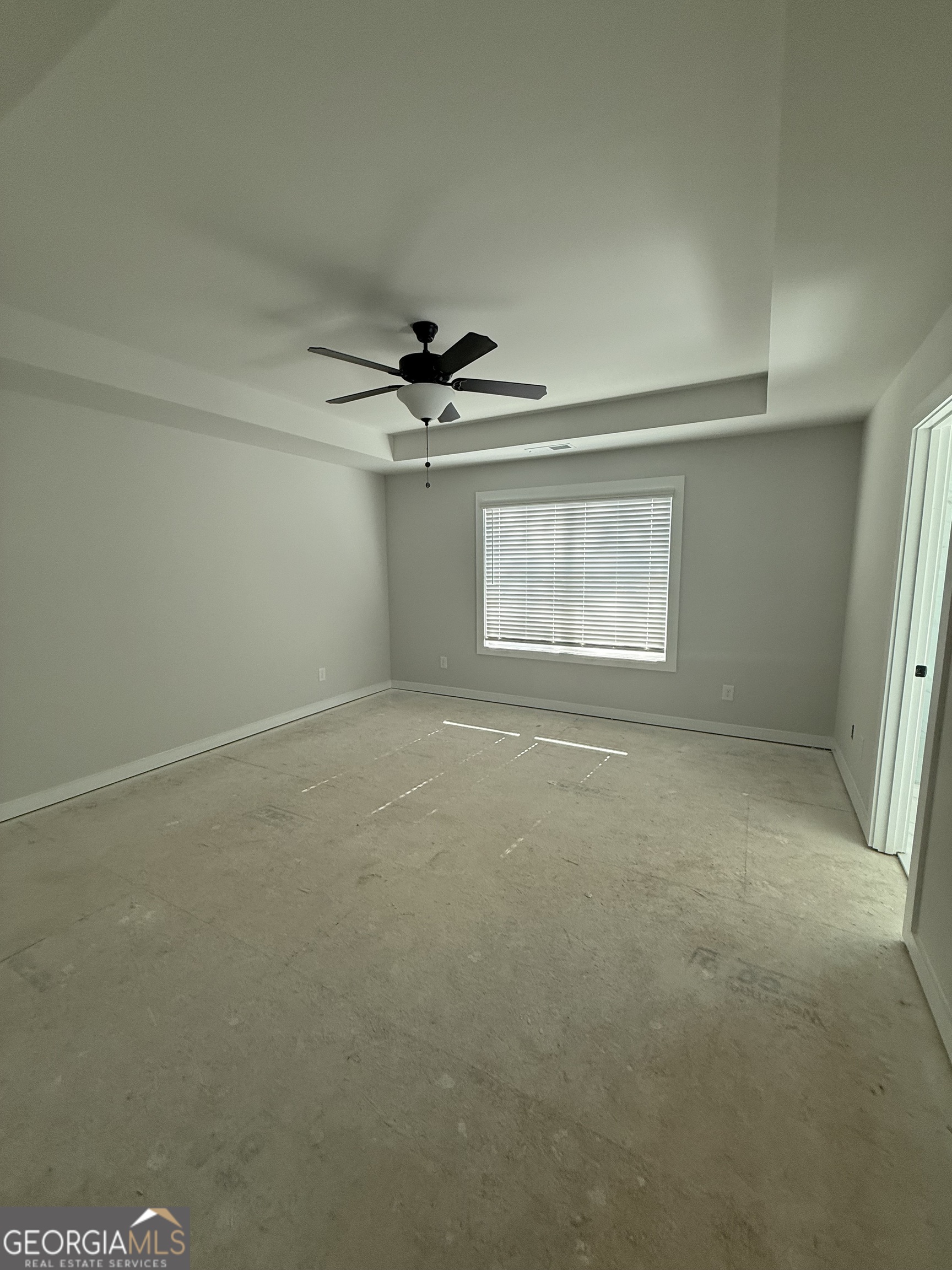 210 Villa Rica Springs Villa Rica, GA 30180 - Photo 15 of 24 en empty room with windows and ceiling fan view