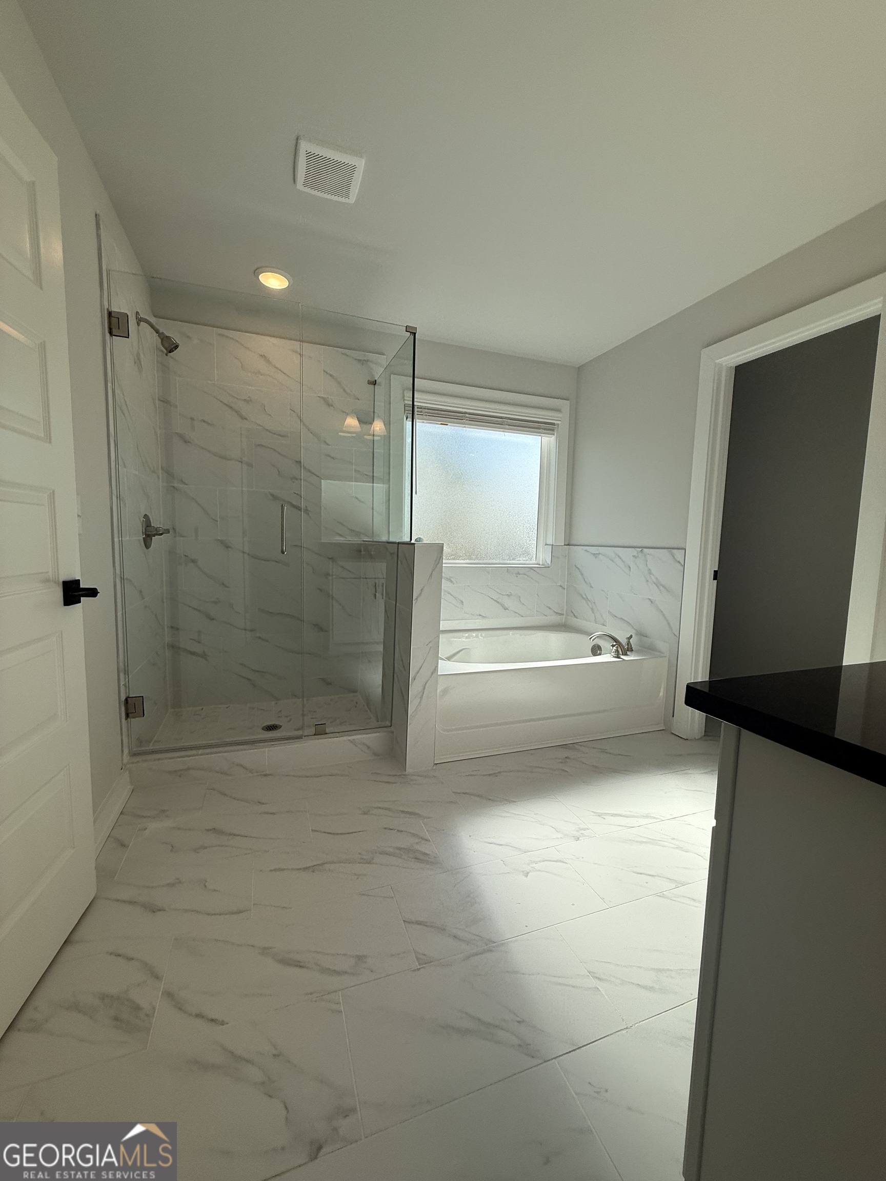 210 Villa Rica Springs Villa Rica, GA 30180 - Photo 18 of 24 a view of a bathroom with a tub and shower