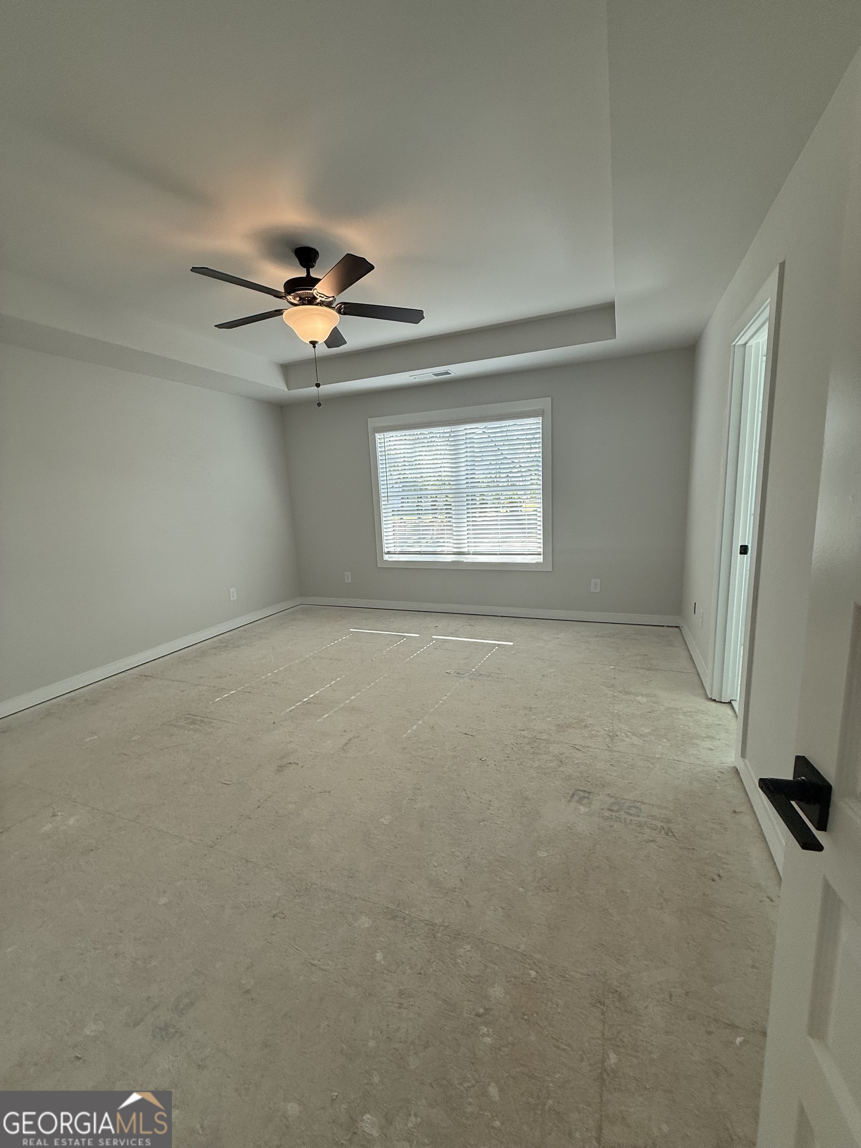 210 Villa Rica Springs Villa Rica, GA 30180 - Photo 20 of 24 an empty room with windows and fan