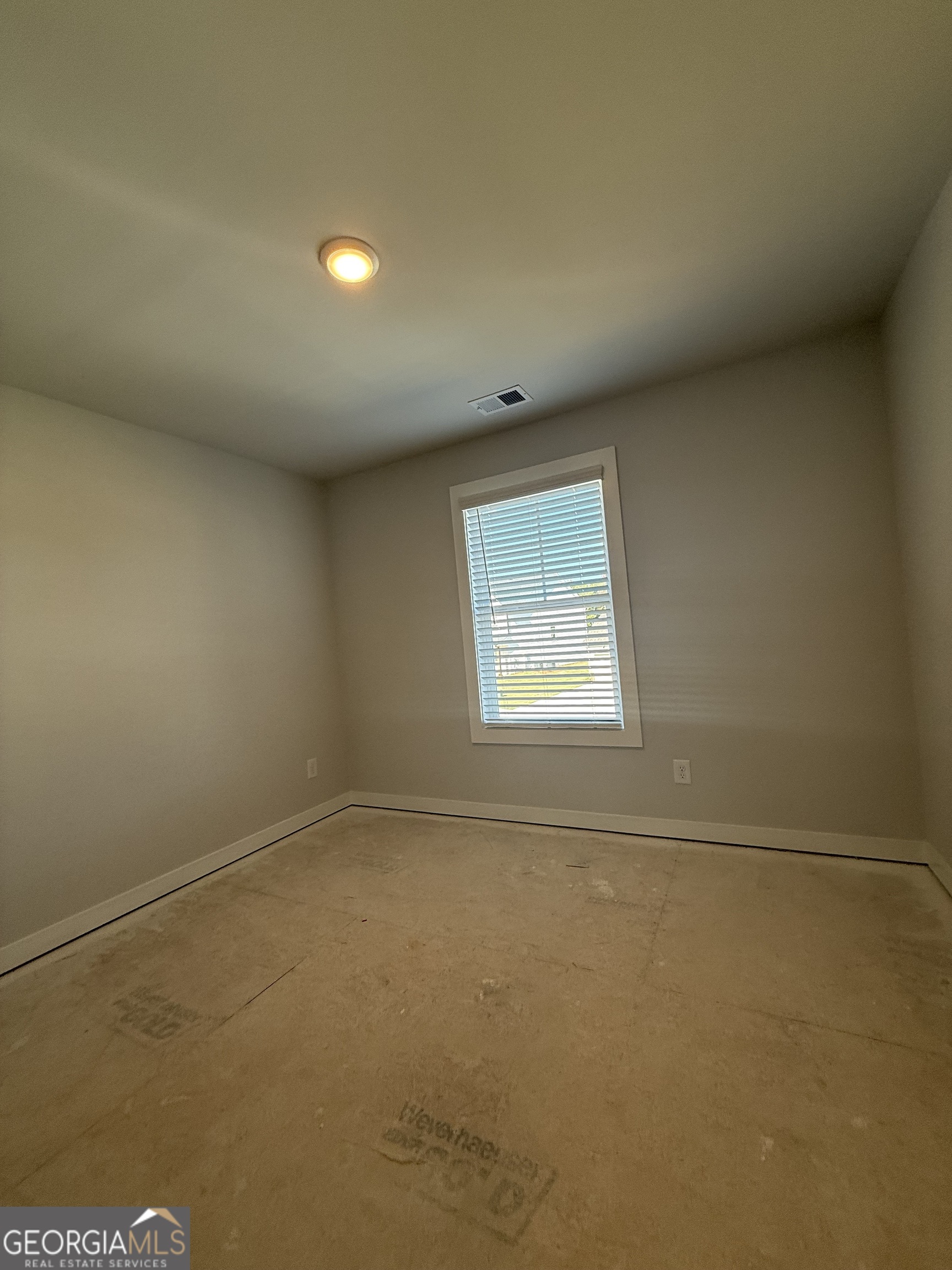 210 Villa Rica Springs Villa Rica, GA 30180 - Photo 23 of 24 an empty room with a window