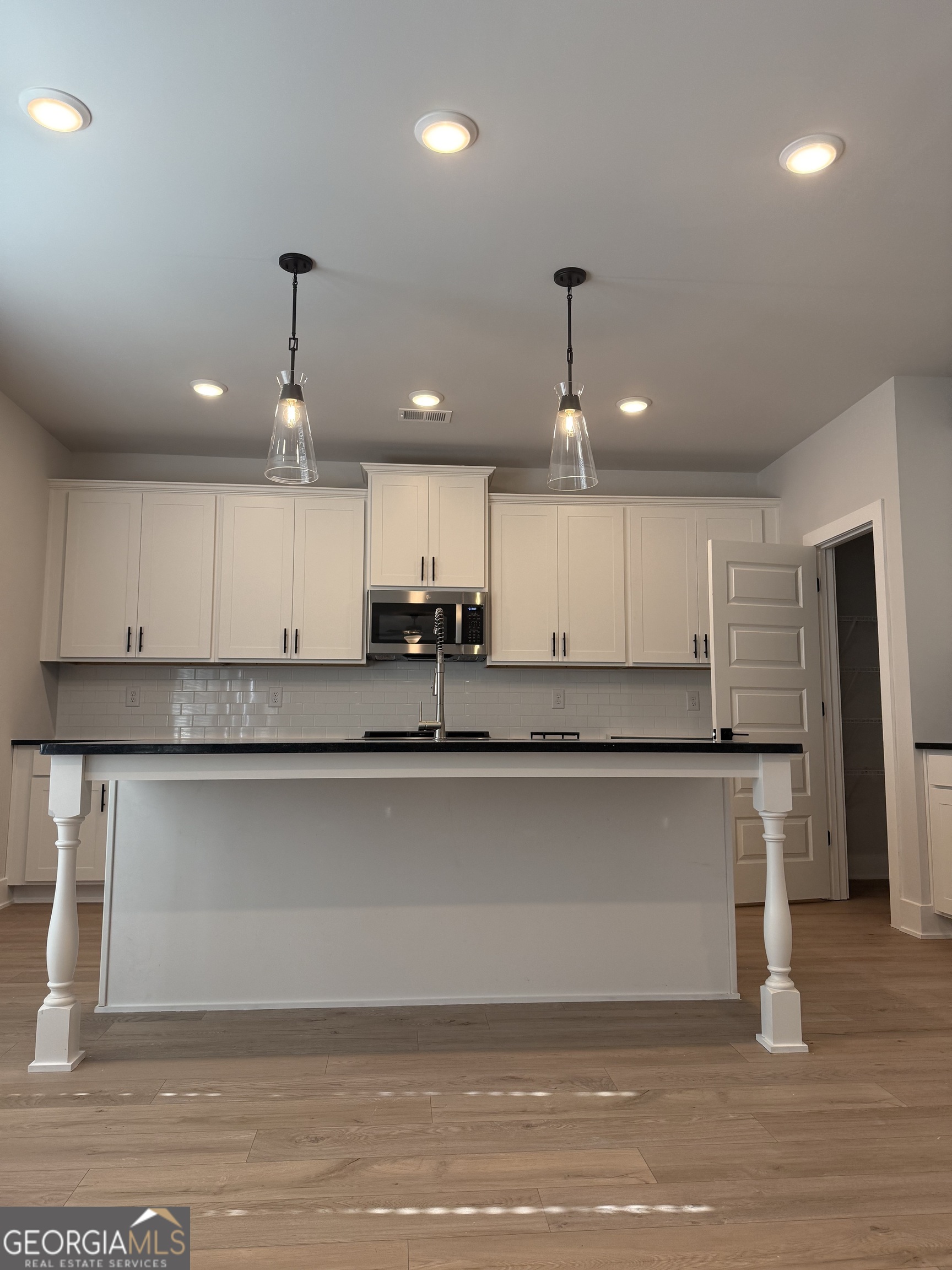 210 Villa Rica Springs Villa Rica, GA 30180 - Photo 4 of 24 a kitchen with stainless steel appliances granite countertop a refrigerator a sink and a stove